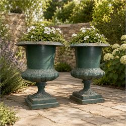 Pair of Victorian cast iron campana garden urns, the flared rim with repeating stylised an...