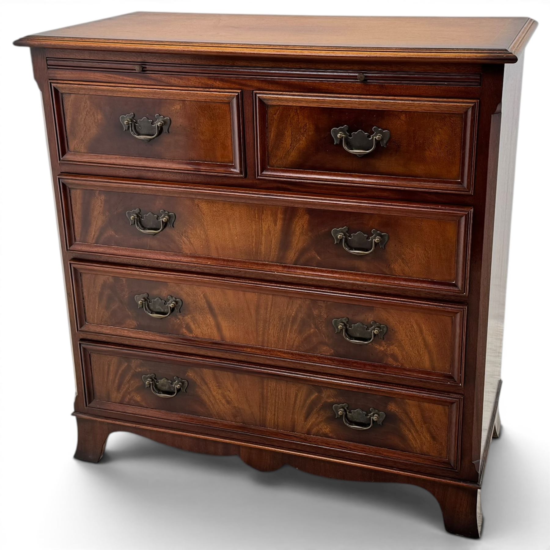 Charles Barr - mahogany bachelor's chest, with brushing slide two short over three long drawers with moulded edges, shaped apron raised on bracket feet