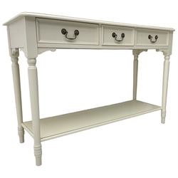 Laura Ashley - 'Clifton' ivory finish three drawer console table, fitted with three frieze drawers with heavily moulded edges, raised on turned supports united by undertier