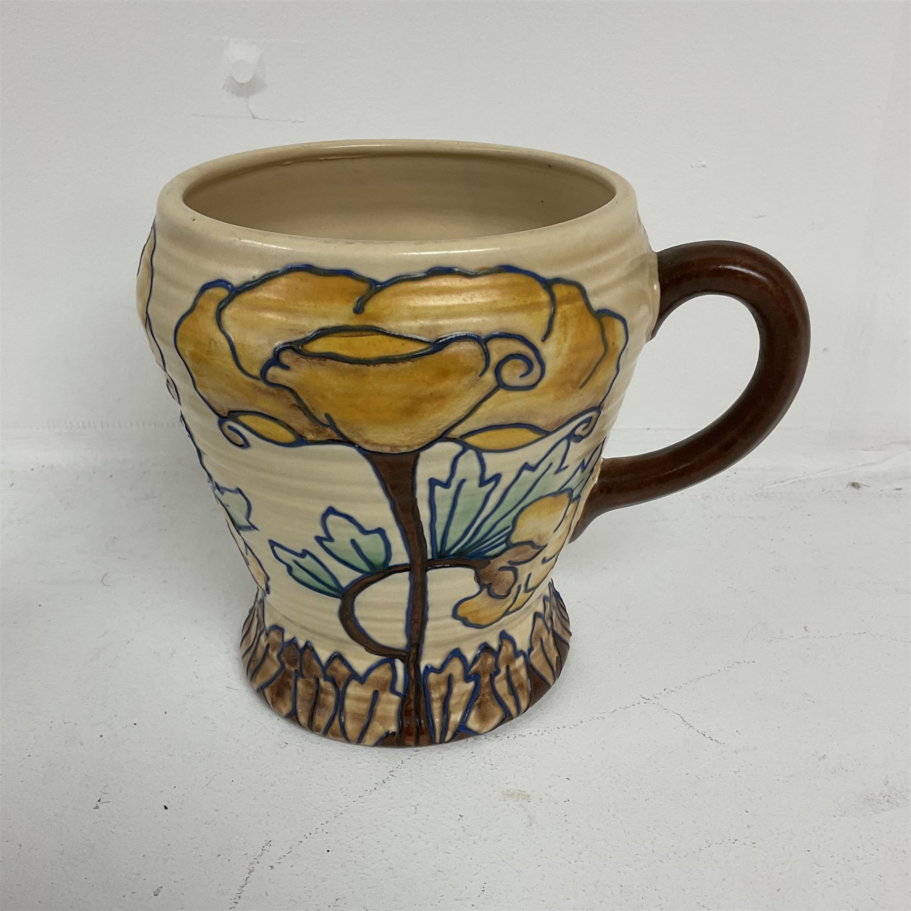 Royal Cauldon single handled vase of tapering form tube lined with a floral pattern by Edith Gater H17cm