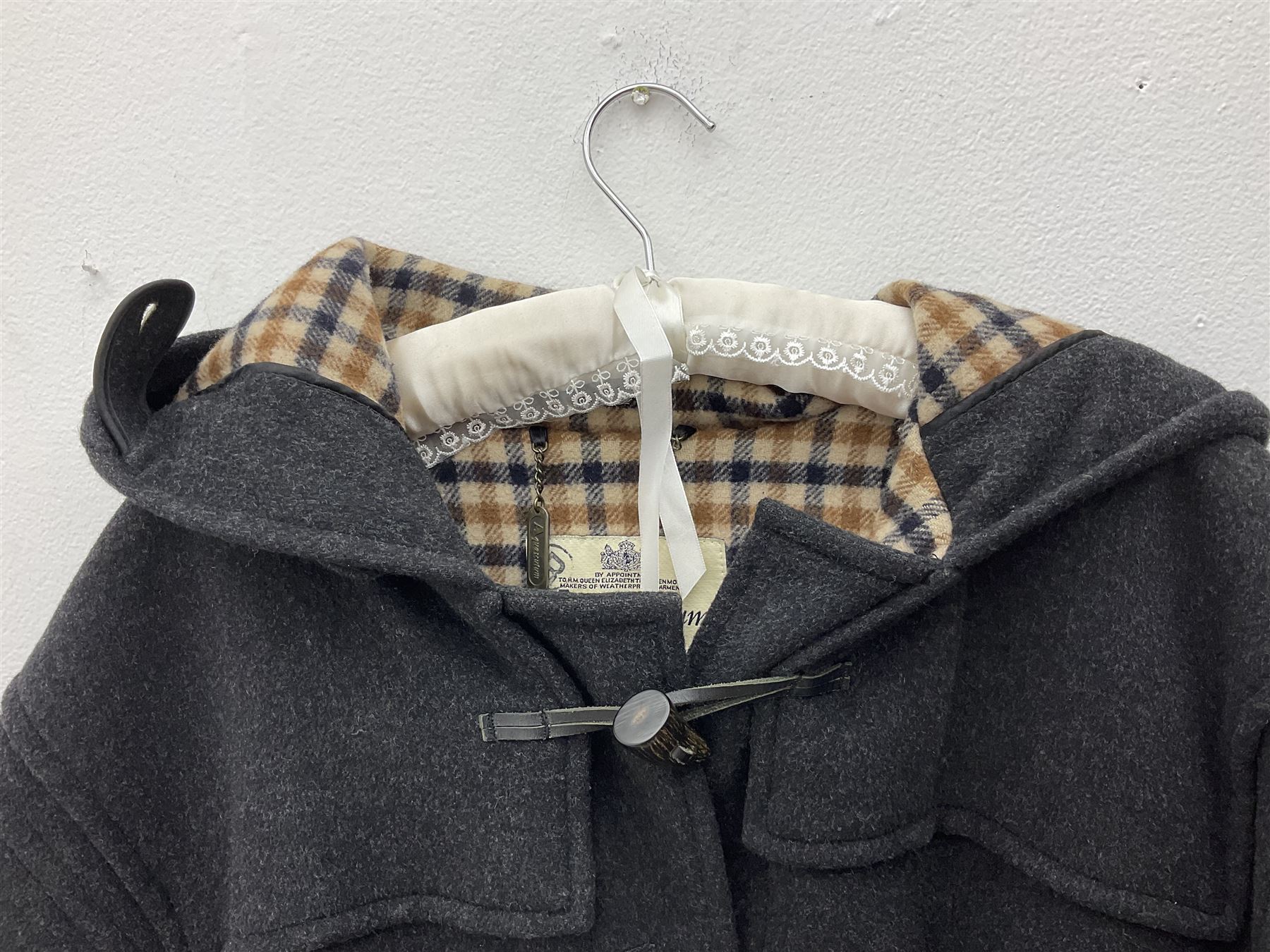 Men's Aquascutum lambs wool herringbone tweed coat with silk lining, 46 Reg, together with a further Men's Aquascutum grey wool duffle coat, with cheque lining and horn buttons, 46