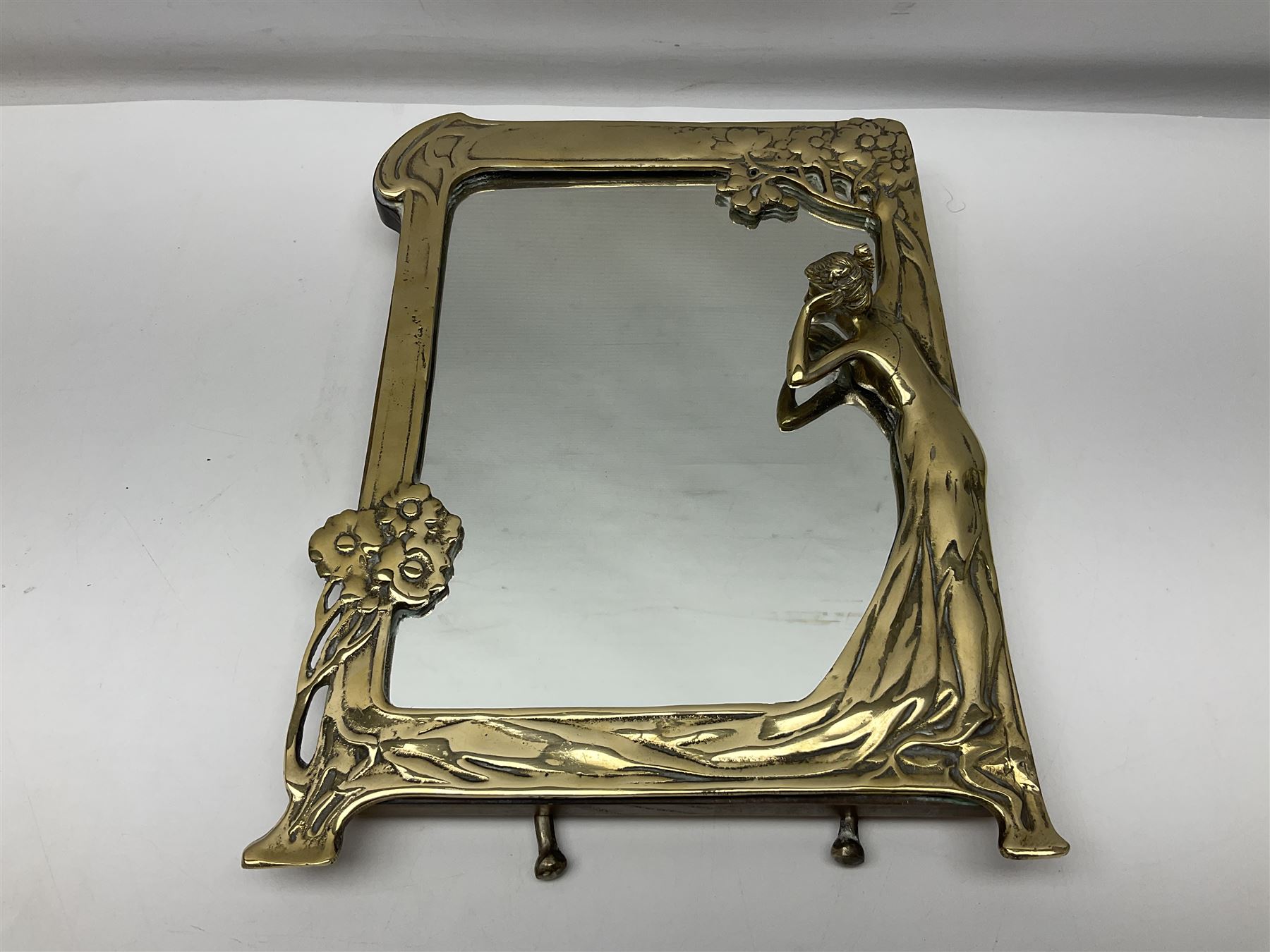 Art Nouveau style mirror in the manner of WMF, decorated with a female figure and floral motifs, the easel support verso with spurious WMF, H35cm
