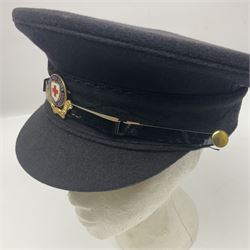 1950s British Red Cross North Yorkshire dress uniform comprising tunic, trousers, greatcoat and visor cap; bears manuscript label '1956 Ware'