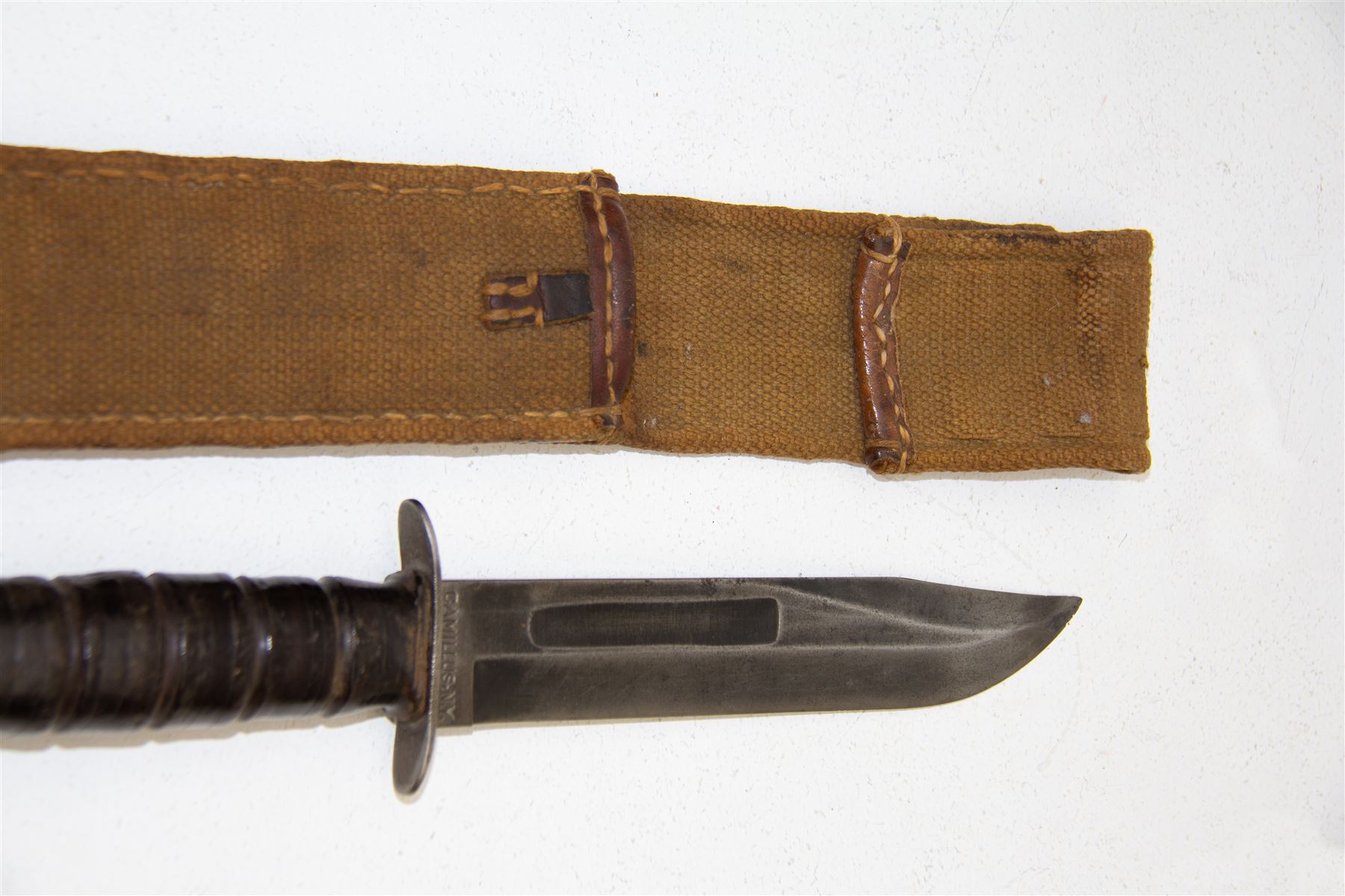 United States Marine Corps USMC KA-BAR Fighting Knife, blade marked CAMILLUS N.Y and USMC, with canvas scabbard, L30cm  