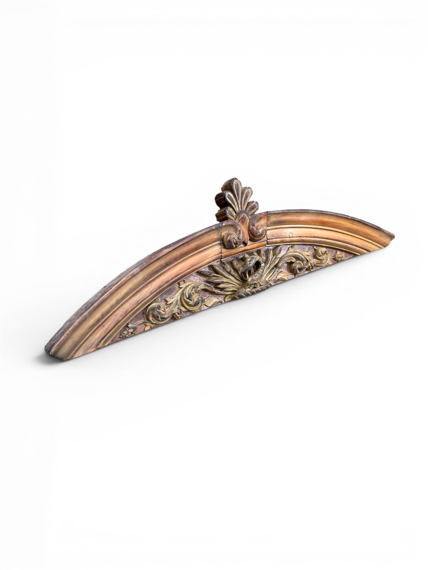 19th century carved pine architectural pediment, detailing floral swags with berries and central serpentine snake head 