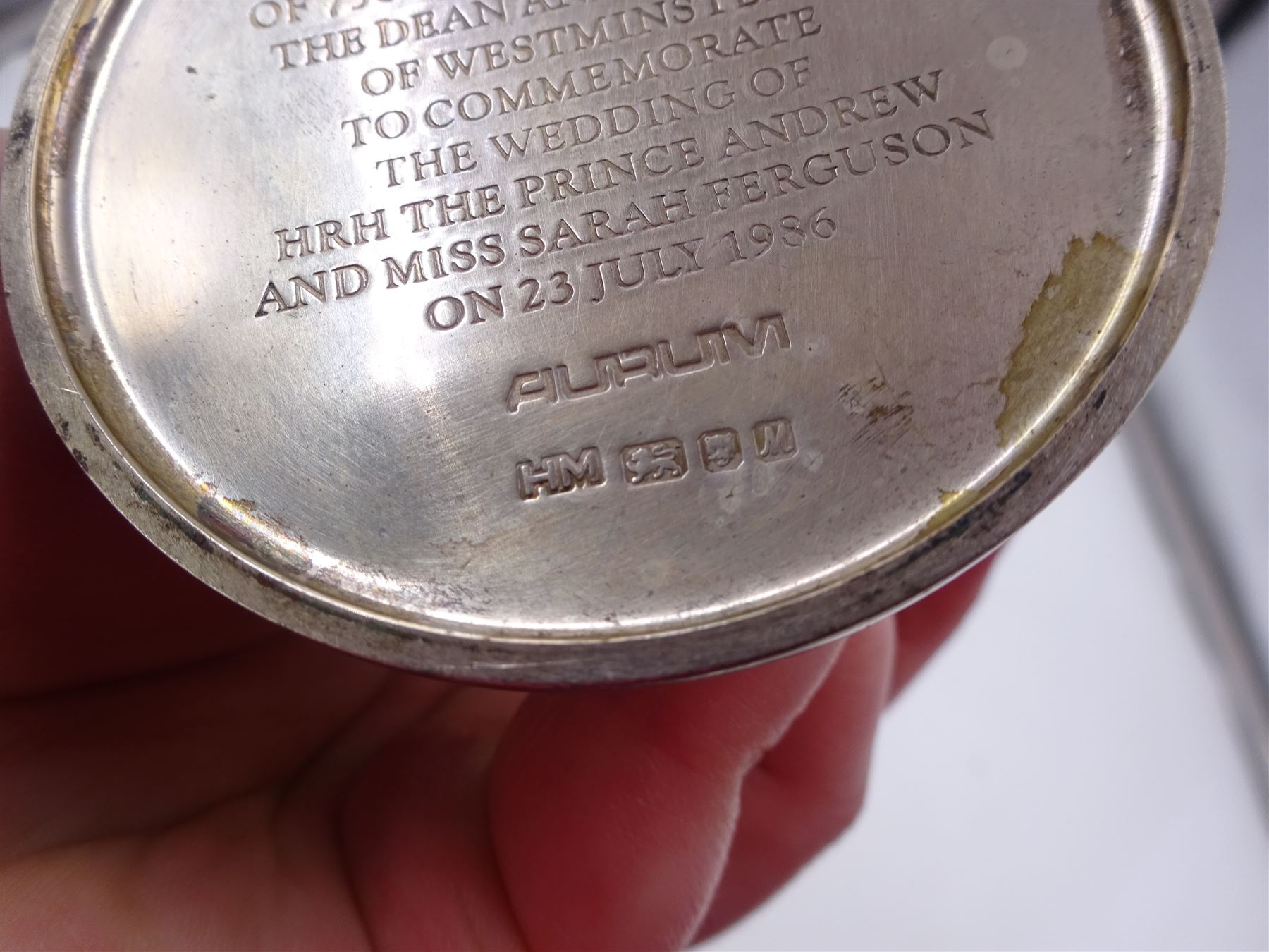 Modern limited edition silver Westminster Abbey Royal Wedding goblet, commemorating the marriage of HRH Prince Andrew and Miss Sarah Ferguson on the 23rd of July 1986, designed by Hector Miller for Aurum, the tapering cylindrical bowl with gilt interior and parcel gilt pierced band to base depicting the Royal Arms, upon knopped stem and circular stepped foot with floral parcel gilt rim, no. 483/750,  hallmarked Hector Miller, London 1986, H17cm