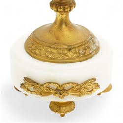 French-Ormolu and white marble mantle clock with garnitures, c 1910, with a white enamel dial and Arabic numerals, indistinct signature, pierced gilt-metal hands and minute markers, 8-day twin train countwheel striking movement, sounding the hours and half-hours on a bell, with a matching pair of two light candelabra. With pendulum and key.