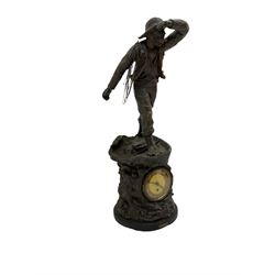 An inspiring early 20th century spelter effect figure of a sailor standing in the bow of a boat scanning the horizon, on a simulated rock base with a plaque entitled 'Rescue', base fitted with a timepiece clock movement and two-part dial, with pierced hands, gilt dial centre and ivorine chapter ring written in Arabic numerals, German HAC spring driven going barrel movement wound from the front. 
With pendulum.



