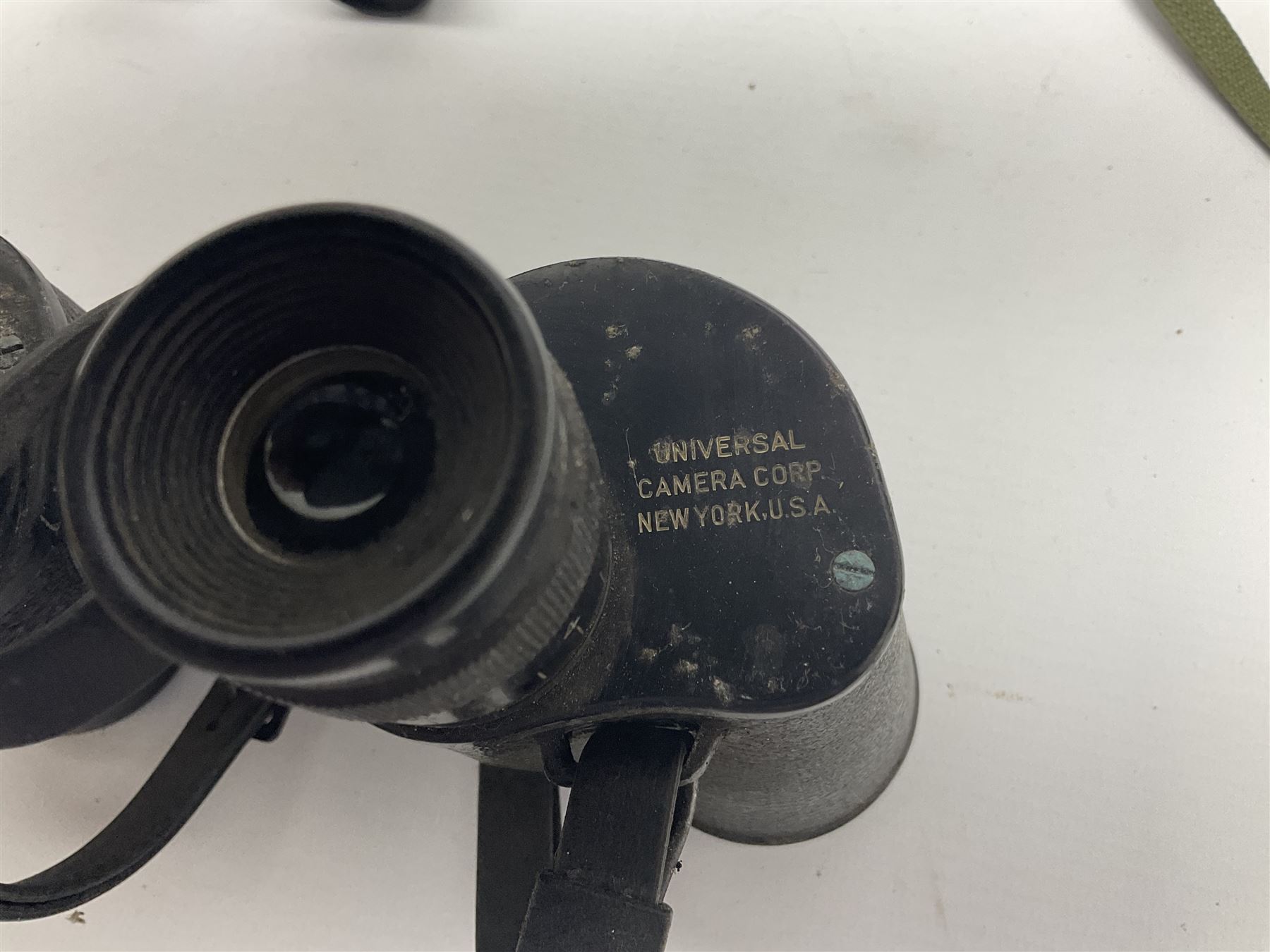 Pair of British World War Two issue black-painted binoculars, Bino 7x50 No. 5, 6E/320, No. 87412, MoD.B/42, with case, together with Nipole 10 x 50 binoculars and two other pairs