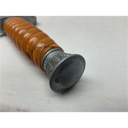 Late WW2 German Army Officers dress dagger, with unmarked 25cm double edged steel blade, orange celluloid grip, pommel and ferrule with oakleaves relief and cross guard with eagle; in original beaded scabbard with two hanging rings L39.5cm overall