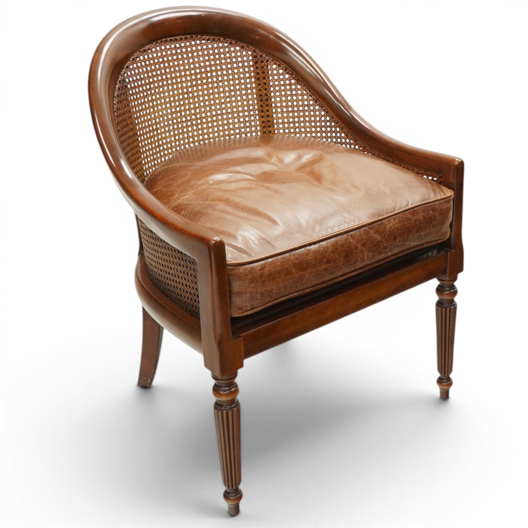 Laura Ashley - pair of bergère tub armchairs with leather seats, raised on fluted and turned supports