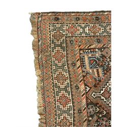 Persian rug, overall geometric design, the field with six interlinked lozenge medallions surrounded by stylised animal and geometric motifs, multiple band border with geometric patterns 