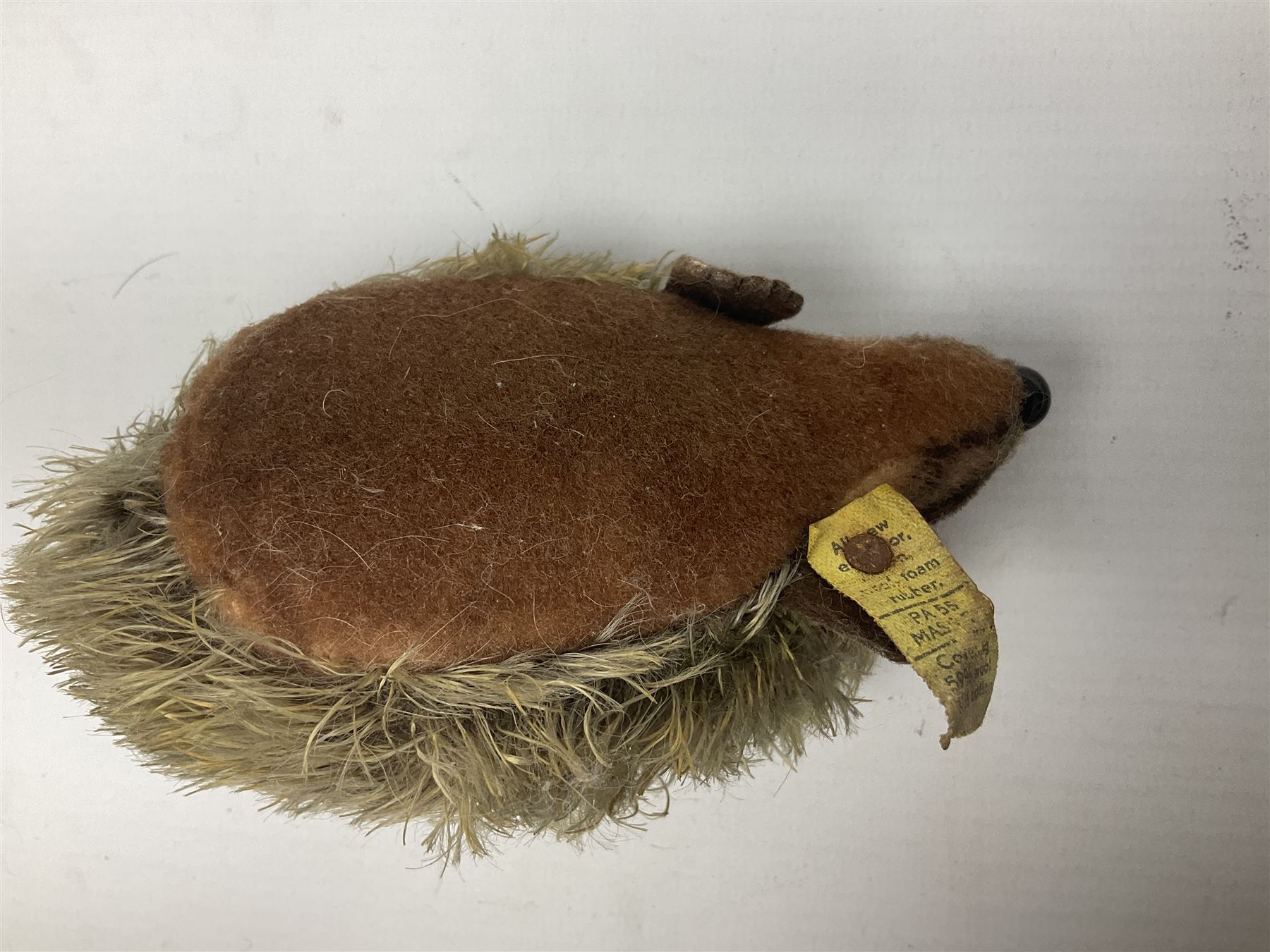 Group of Steiff figures, comprising Mikki and Mukki, circa 1950s no 7628/12 and 7627/12, with original tags, two hedgehogs no 1570/10, and another smaller 1670/03, small owl no 7480/06, and painted metal Steiff harlequin style bear