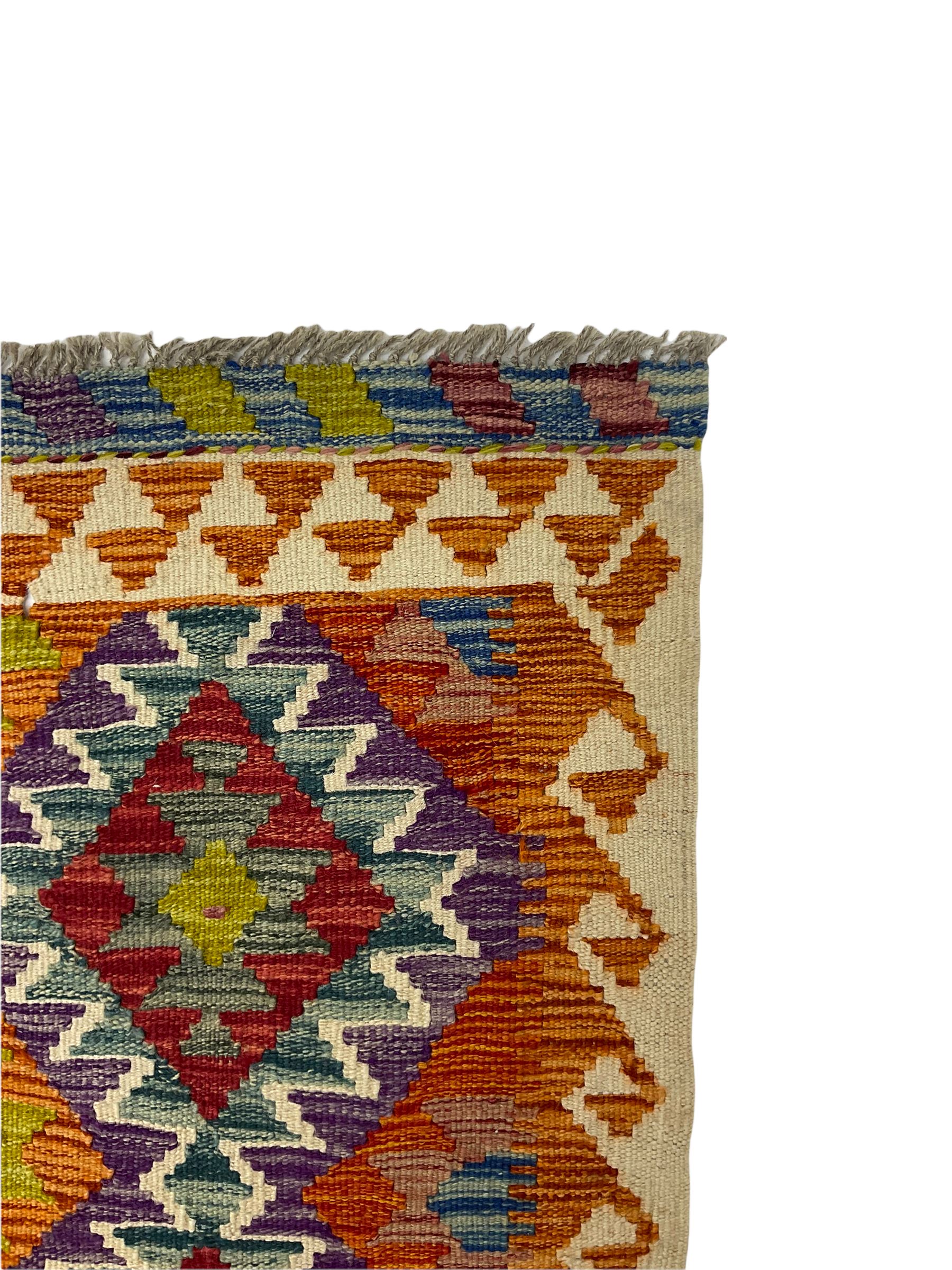 Chobi kilm runner, multi-colour ground, repeating stepped lozenge design