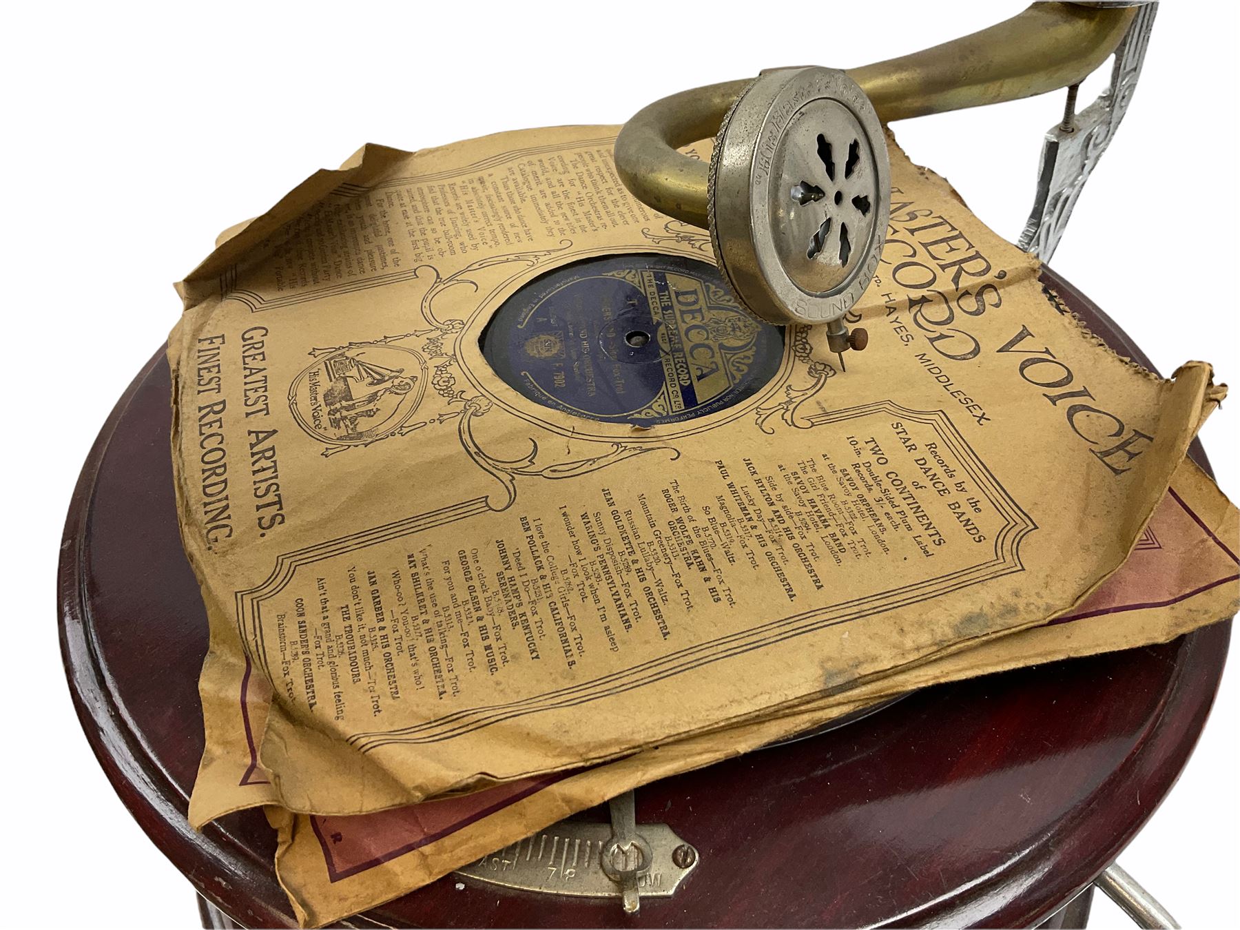 His Master's Voice table top wind up gramophone on a circular wooden base, with brass horn, H72cm, Horn D43cm. 