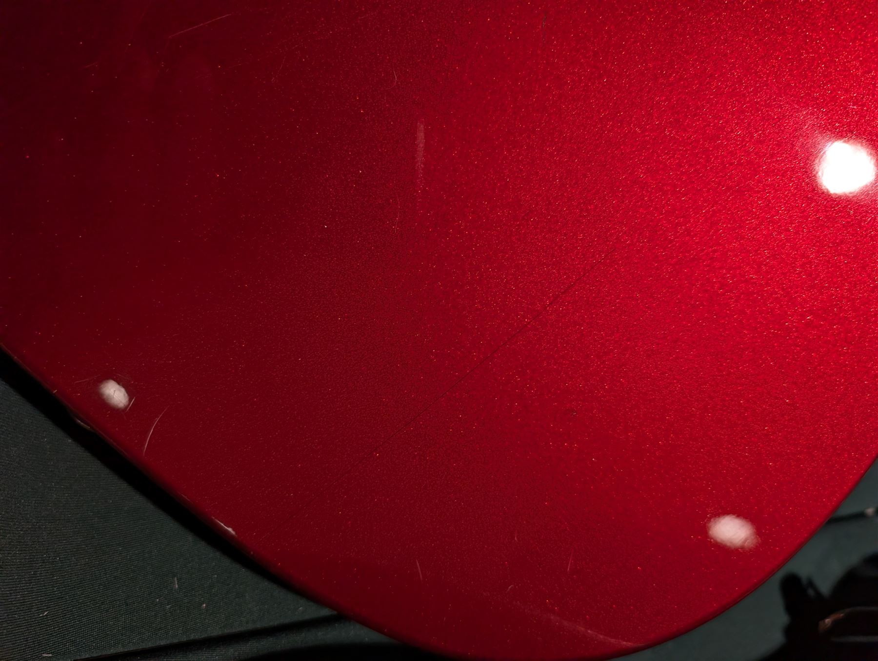 Fender Telecaster electric guitar, serial no. T021384 made in Japan c.1994, with Candy Apple Red body, white scratch plate and maple neck, guitar L98cm