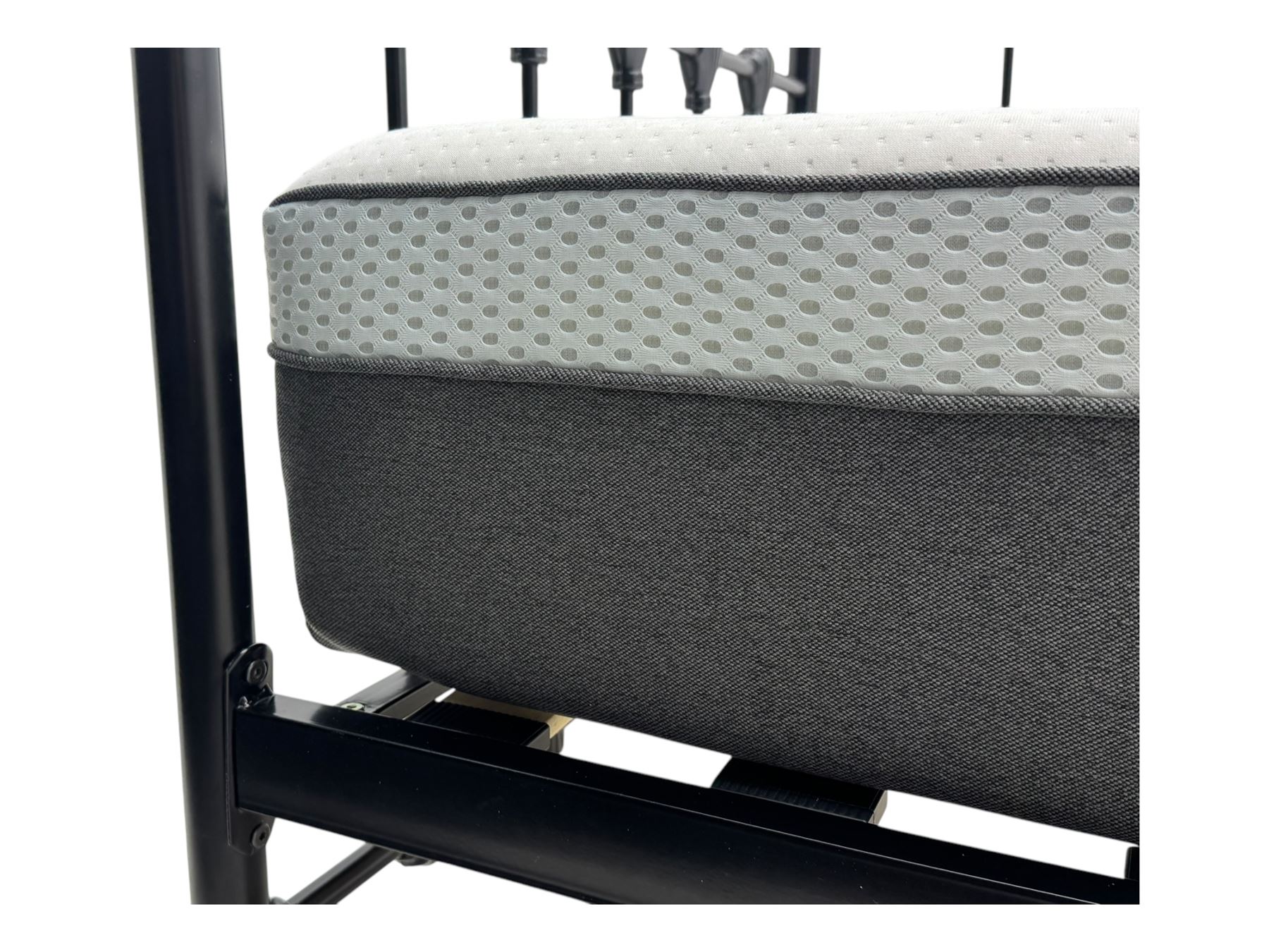 Contemporary Victorian revival black metal day bed, featuring arched back and sides with turned finials and spindle rails, complete with single 'OTTO' mattress