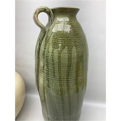Large cream crackle glaze table lamp, together with a tall studio pottery vase in green with single loop handle, with impressed makers mark, H49cm