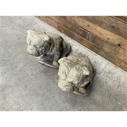 Pair of cast stone garden British bulldogs, on shaped plinths