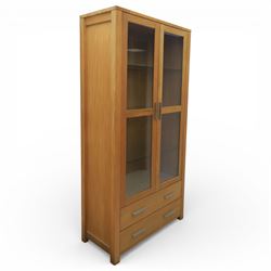 Solid light oak bookcase display cabinet, fitted with two glazed cupboards and two drawers