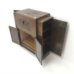  Eastern carved rosewood cocktail cabinet, double hinged lid enclosing mirrored back, four cupboard doors enclosing shelves, W74cm, H86cm, D37cm  