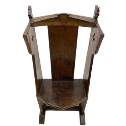 'Gnomeman' oak hall chair, the cresting rail carved with shield, plain rectangular back on figured canted seat, shaped upright end supports pierced with star motif, on sledge feet joined by stretcher, carved with gnome figure, tooled and adzed all over

Provenance - This collection of early 'Gnomeman' furniture comes to us directly from the Whittaker family. The pieces were made by the vendor's father Thomas Whittaker in the 1930/40s for his own use. During this time, he lived in York and made items for himself and friends. Whittaker adopted the gnome as a signature and trademark after his move to Littlebeck, Whitby.