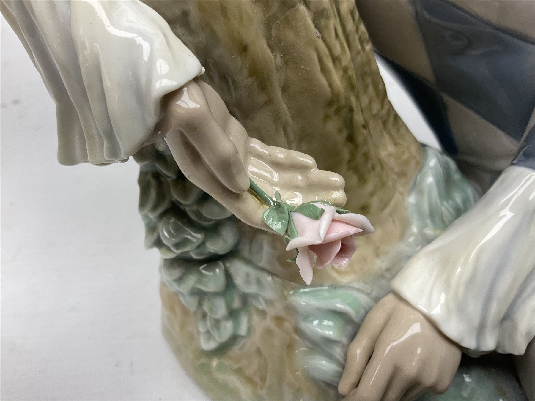 Lladro figure, Harlequin Reclining, modelled as a recumbent harlequin, no 5128, Sculpted by Salvador Furio, year issued 1982, year retired 1987, H28cm 