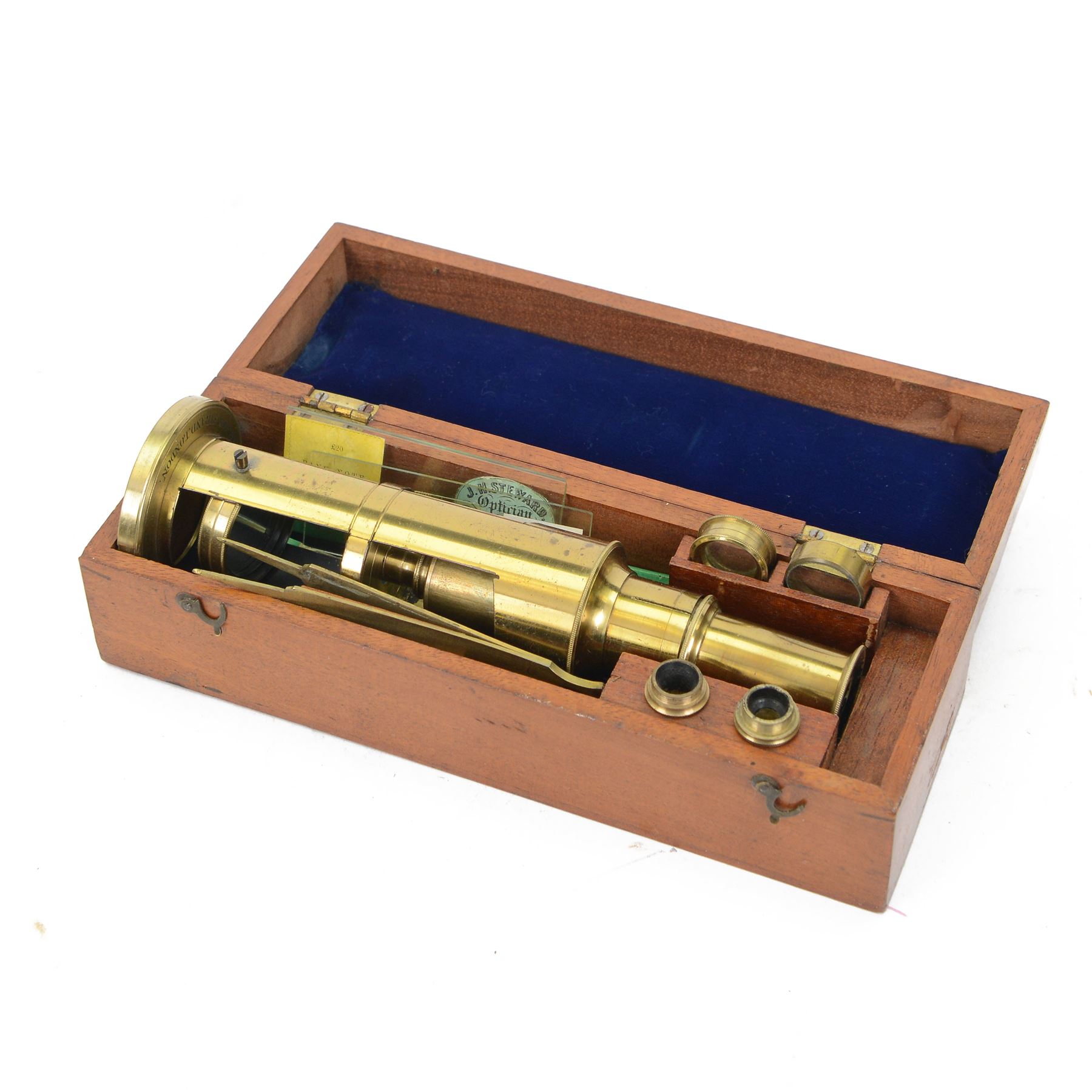 19th century portable brass microscope by J H Steward, 406 The Strand London, with four lenses, tweezers and a small collection of microscope slides, contained within a fitted wooden box