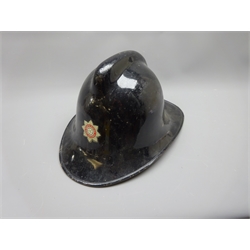  North Riding Fire Brigade Helmet, black with red and silver badge, stamped NP with liner and chinstrap, a North Yorkshire Fire Brigade Helmet, yellow with red and silver badge, stamped Small upto 67/8 1972 with liner and chinstrap, a WWll Fire Helmet and a WWll green tin helmet stamped R.O.Co. 9, 4   