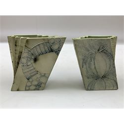 Pair of Carn Pottery Penzance vases of fan form, with tube lined floral and stylised decoration, stamped and marked X9 to base, H11.5cm