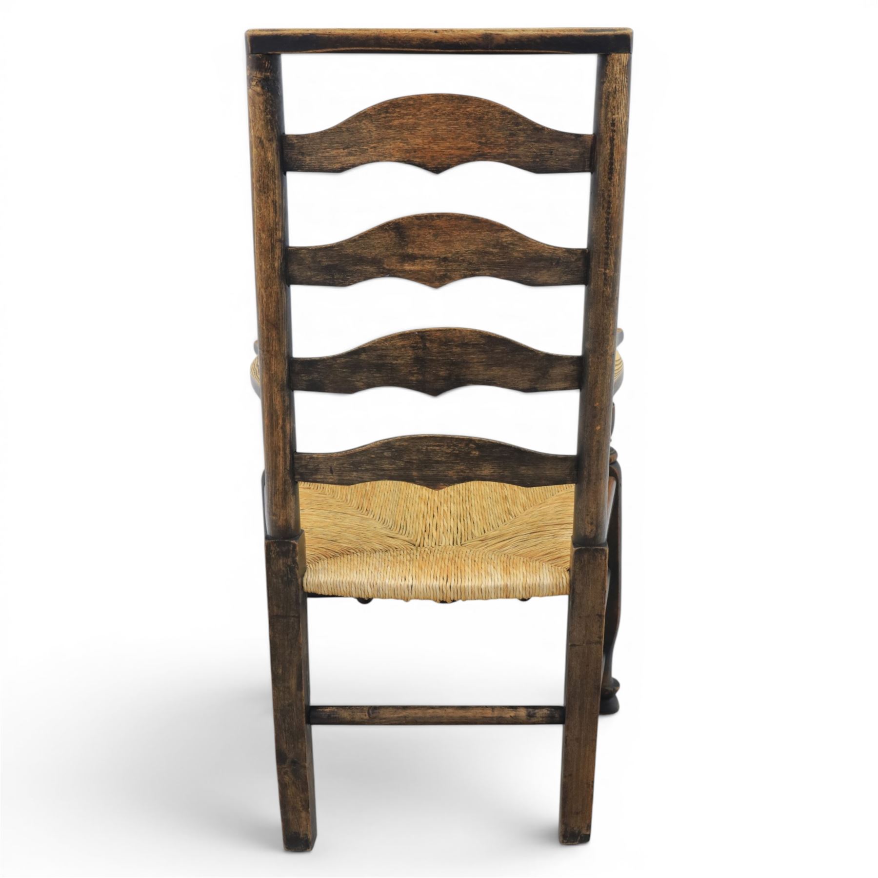 Set of seven (6+1) Georgian design country elm Lancashire dining chairs, ladder backs with rush seats, turned front leg stretcher on pad feet, height of seat 44cm, complete with fitted tie on cushions