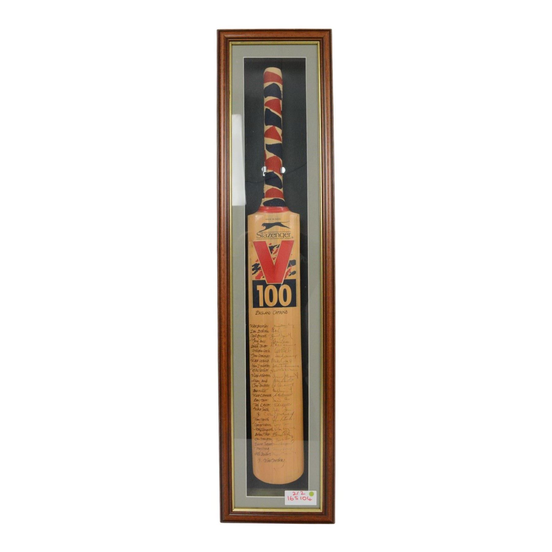 Two signed Slazenger V 100 cricket bats, the first example signed by the 'World's Top 10 Run Makers', with signatures including Graham Gooch, David Gower, Geoffrey Boycott, Gary Sobers and Viv Richards, the second example signed by a number of England's Cricket Captains, including Alec Stewart, Ken Cranston, Bob Willis, Allan Lamb, Mike Atherton and Ian Botham etc, both within glazed wooden display cases, case H99cm