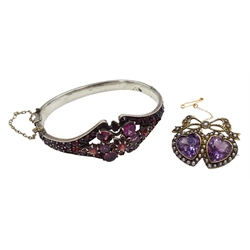 Edwardian gold amethyst and split pearl, double heart design brooch, stamped 9ct and a Victorian silver bohemian garnet hinged bangle, makers mark WJP