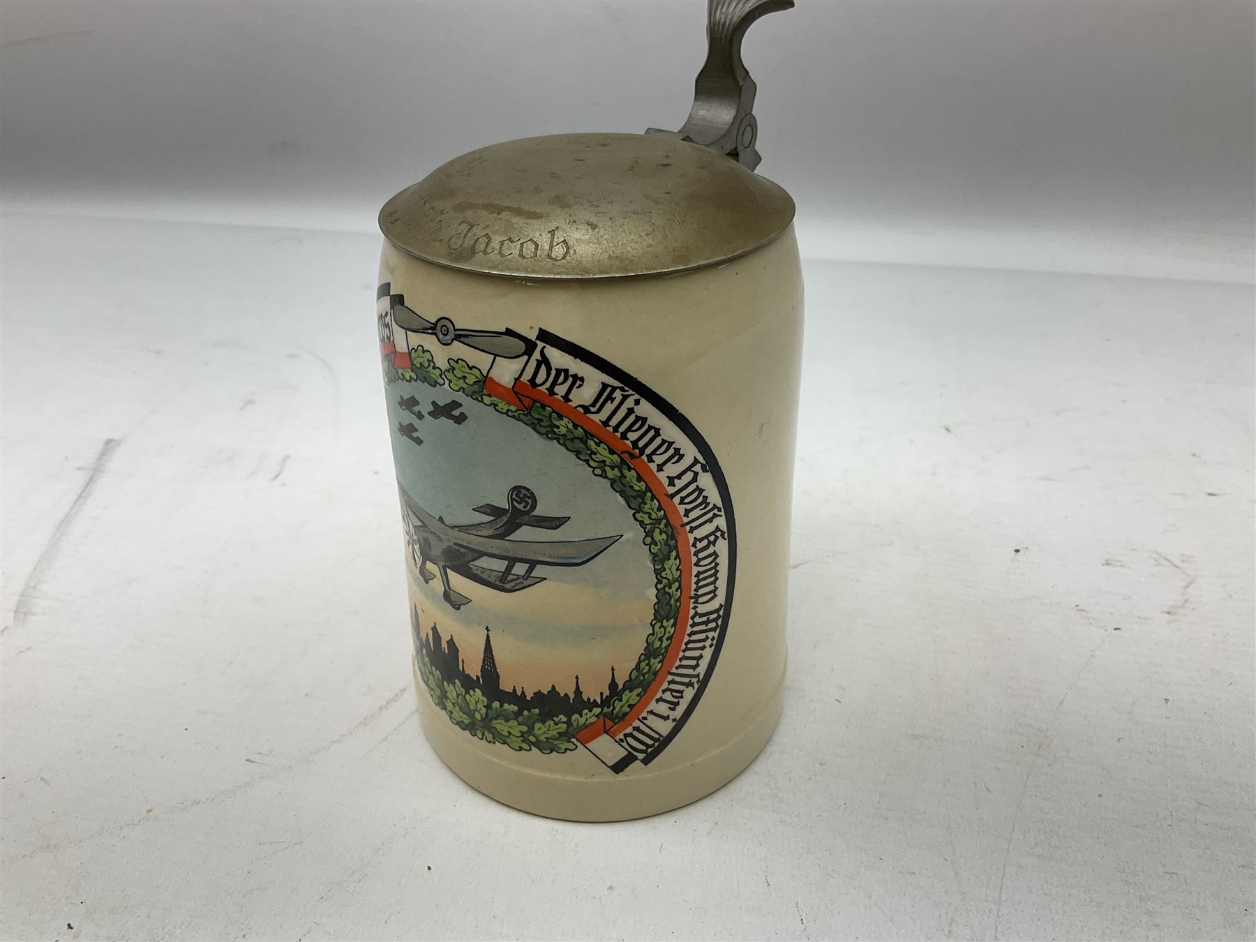German presentation beer stein, printed with a study of a bi-plane, hinged cover engraved UFFZ Jacob, H16cm