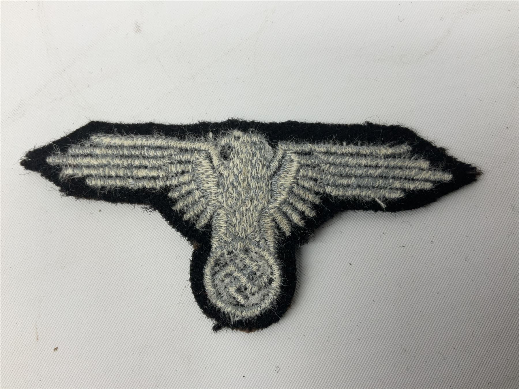 Two WW2 German 'SS' uniform cloth collar patches and sleeve eagle for Schafuhrer rank (3)