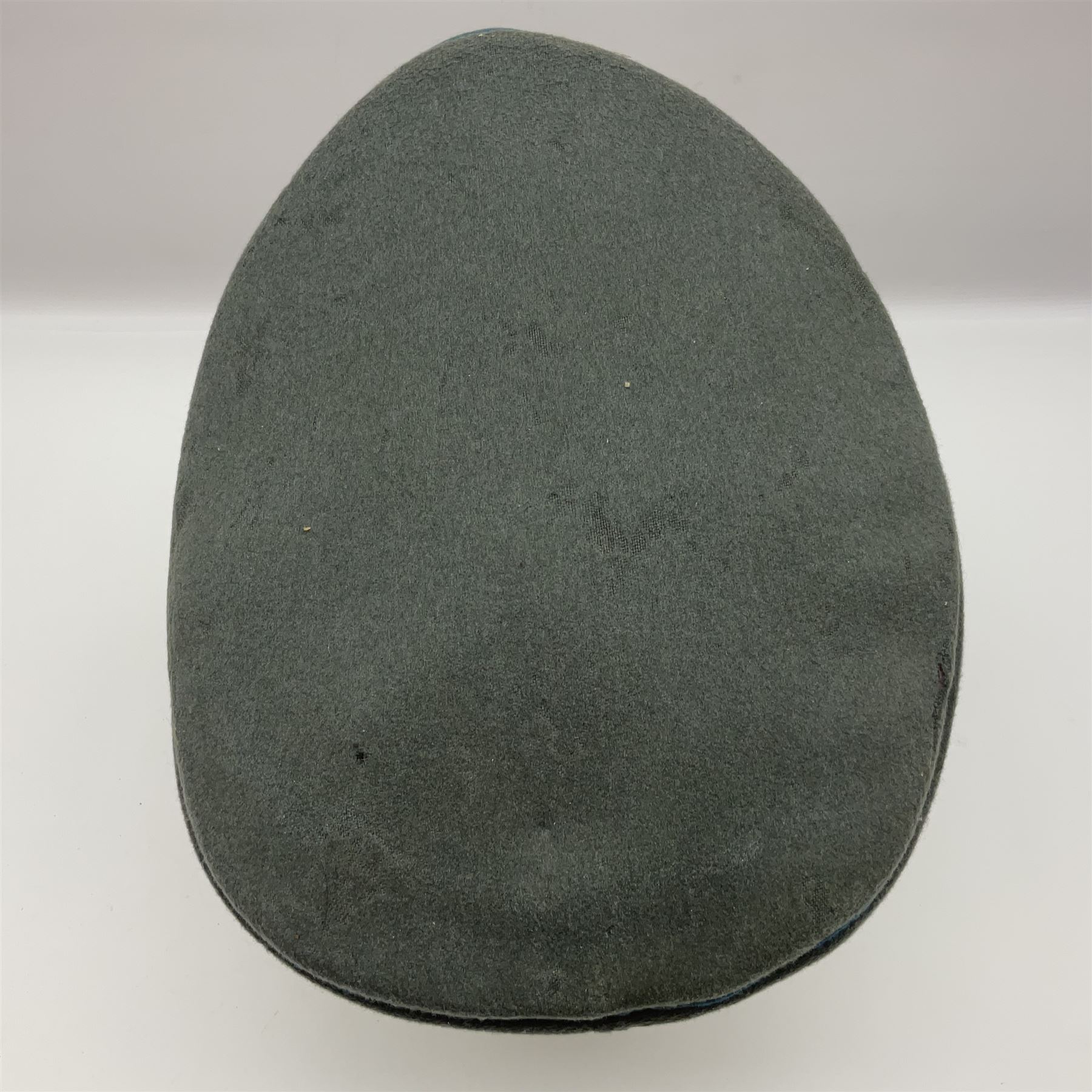 WW2 German Infantry Officer's visor cap with cloth insignia; labelled and stamped Offizier Kleiderkasse Berlin and Erel Stirnschutz