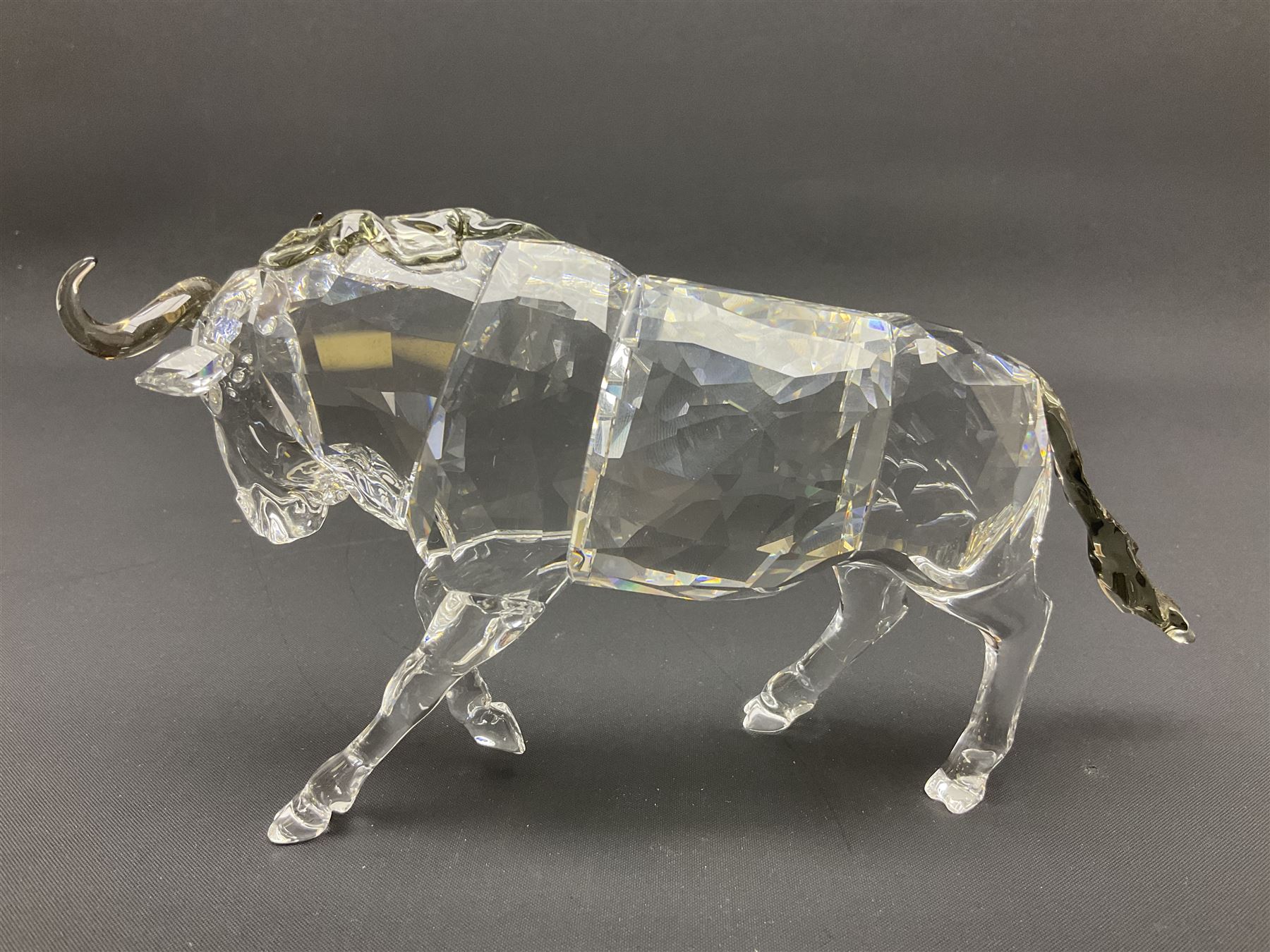 Swarovski Crsytal Society coloured animals, comprising zebra, giraffe and water buffalo, tallest H17.5cm