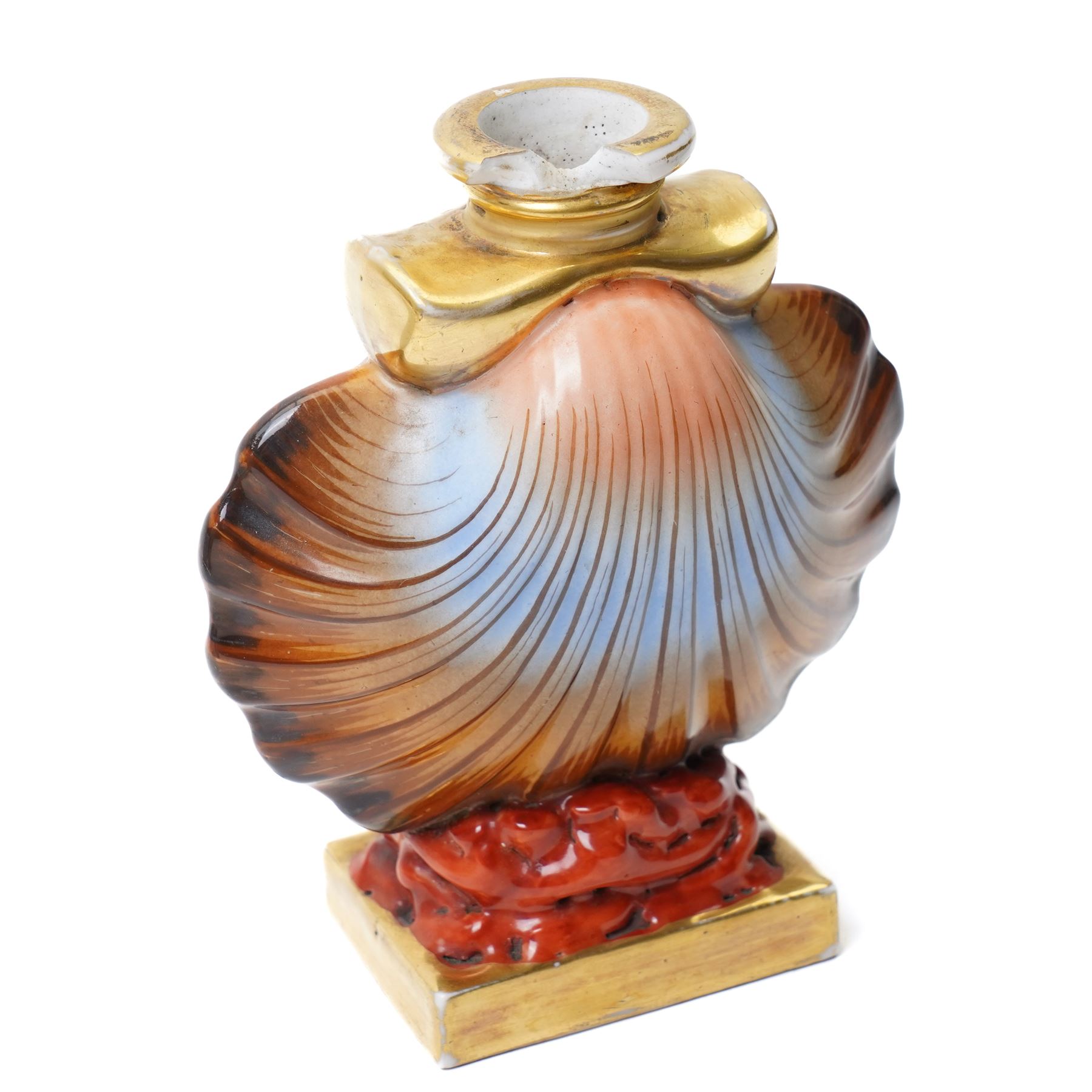 Russian, probably Gardner figure of a man pushing a wheelbarrow on gilt lined rectangular base, impressed mark, H16cm, 18th century creamware beaker with star shape decoration, 18rh century Worcester cup with panels of flowers on a blue ground and a French shell shape scent flask (4)