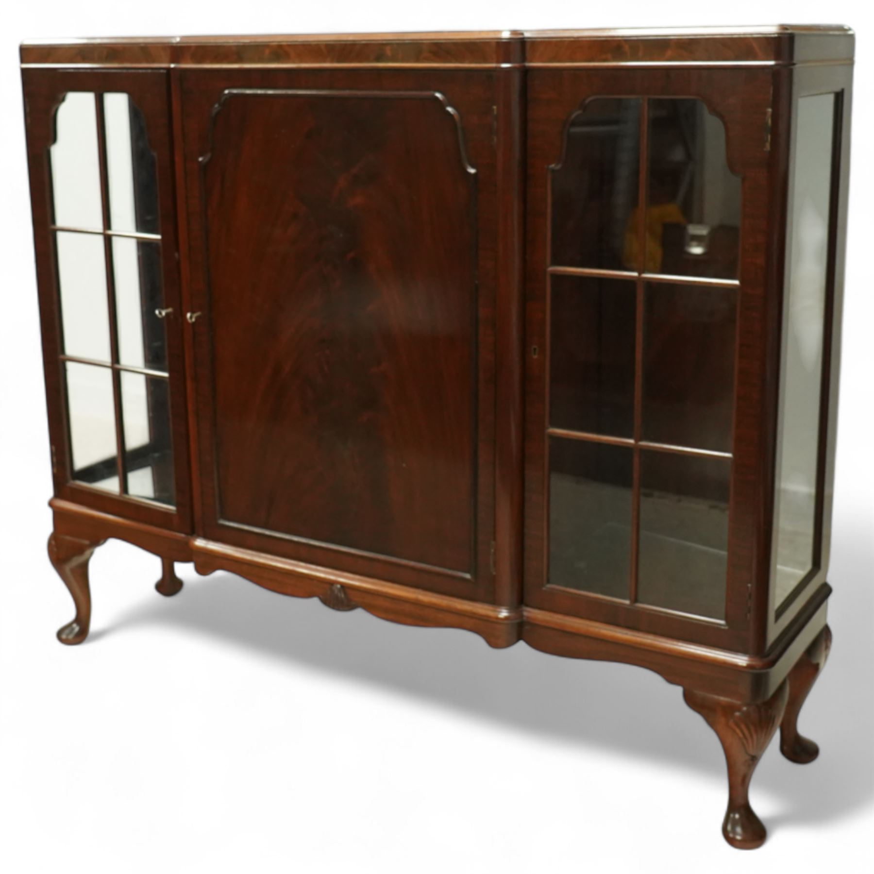 Early 20th-century mahogany glazed side cabinet, rectangular top with moulded edge above central panelled cupboard door enclosing three shelves flanked by two astragal glazed doors enclosing two glass shelves 