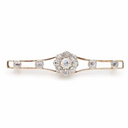 Early 20th century gold and silver diamond brooch, the flower head cluster set with nine o...