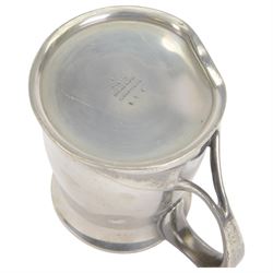 Liberty & Co Tudric pewter tankard, designed by Oliver Baker, model No.066, with a flared rim and whiplash scroll handle, stamped beneath Tudric English pewter, Libery & Co 066