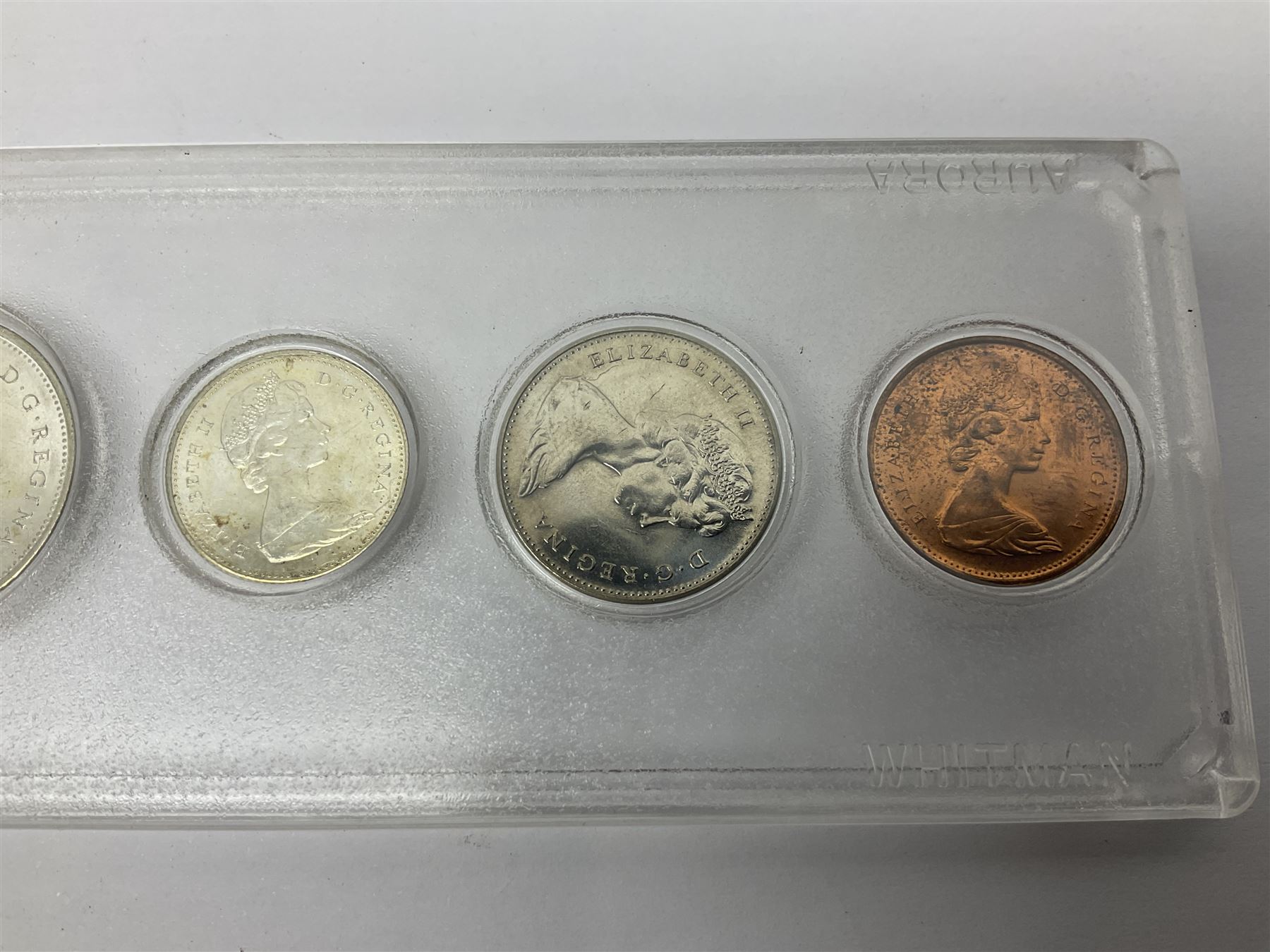 South Africa 1897 one shilling, 1967 one rand, Ireland 1928 two shillings and sixpence, Netherlands 1930 two and a half gulden, two Queen Elizabeth II Canada one dollar coins dated 1958 and 1964, 1967 six coin set in plastic holder etc