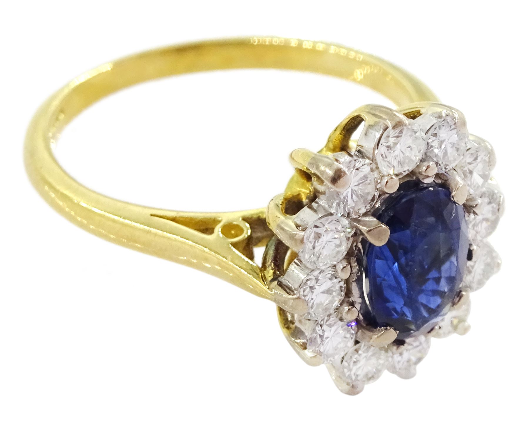 18ct gold oval sapphire and round brilliant cut diamond cluster ring, Birmingham 1994, sapphire approx 1.00 carat, total diamond weight approx 0.70 carat