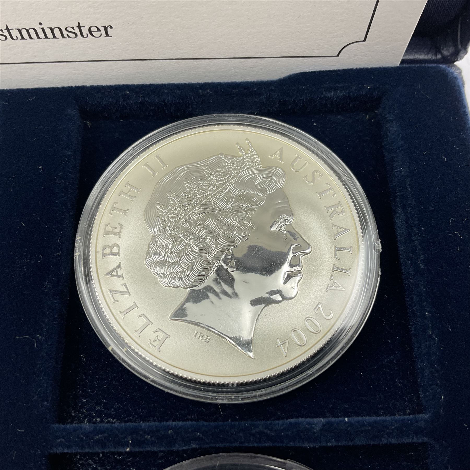 Four one ounce fine silver coins, forming 'The 2004 Famous World Silver Coin Collection', comprising United States eagle, Australian kangaroo, Chinese panda and Canadian maple leaf, cased with Westminster certificate 
