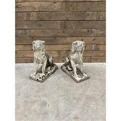 Pair of cast stone garden dogs and 2 female figures,