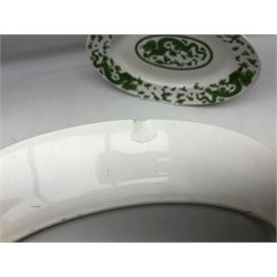 Set of eleven early 20th century Limoges for Green & Abbott of Oxford Street plates, decorated in the chinoiserie style with green dragons upon white ground, together with three further oval serving dishes to include a large twin handled example, all with red printed marks beneath