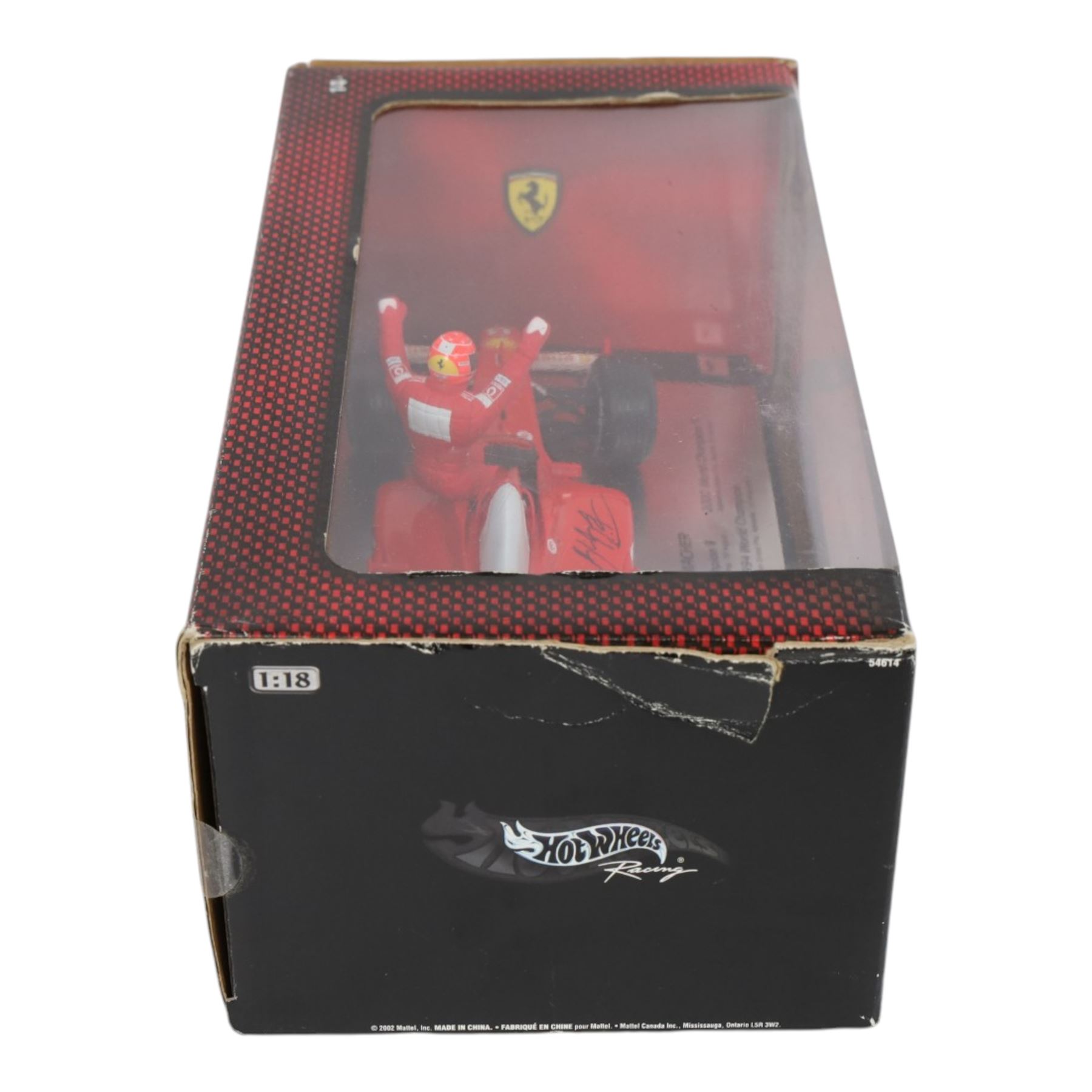 Signed Michael Schumacher Hot Wheels Ferrari 1:18 scale model, 2002 five-times World Champion edition depicting Schumacher sitting on the side of his car with arms raised, with his signature in black marker to wing of car, boxed