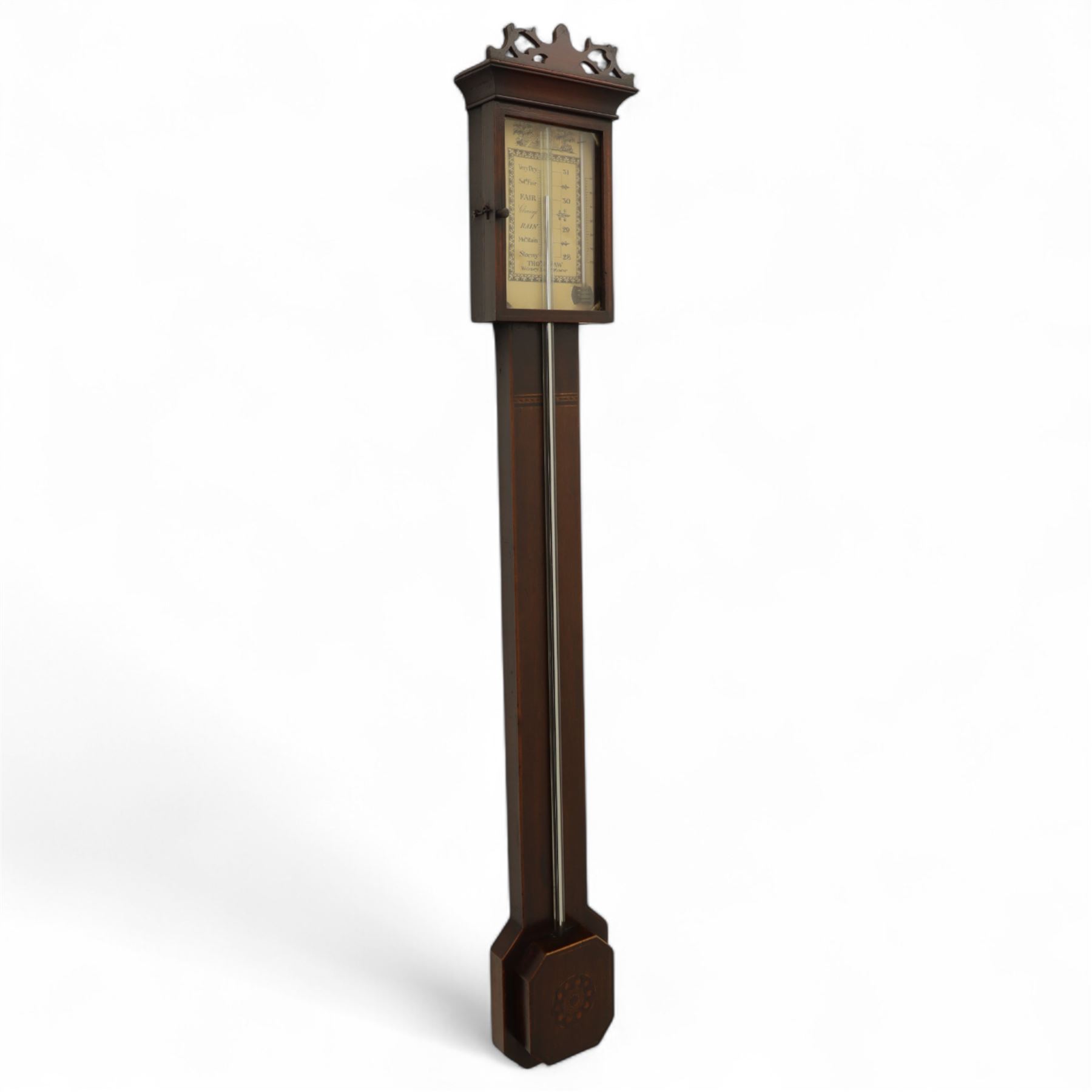 Thomas Shaw of Wibesy, Low Moor, (Bradford) - early 19th century mahogany bulb cistern stick barometer with a fretted pediment and an octagonal base, with satinwood stringing to the edge of the case and contrasting inlay to the cistern cover, enclosed paper scale with makers name, predictions and a Fahrenheit mercury thermometer, exposed tube with a conforming octagonal cistern cover.  
Thomas Shaw is recorded as working in the village of Low Moor 1820-40.
Basic stick barometers made in rural communities were often made for local farmers and were fitted with cheaper paper registers, many of which have not survived. This is a very nice and rare example found in very good condition.  