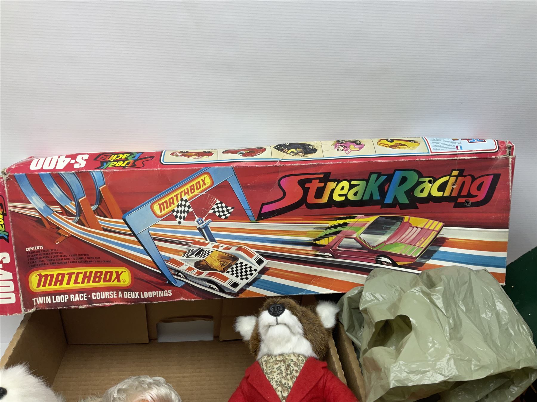 Selcol Beatles New Sound toy guitar, Triang baby walker, Mamod steam engine, wooden Noahs Ark toy, quantity of diecast cars and plastic soldiers and a collection of other toys and board games, in five boxes