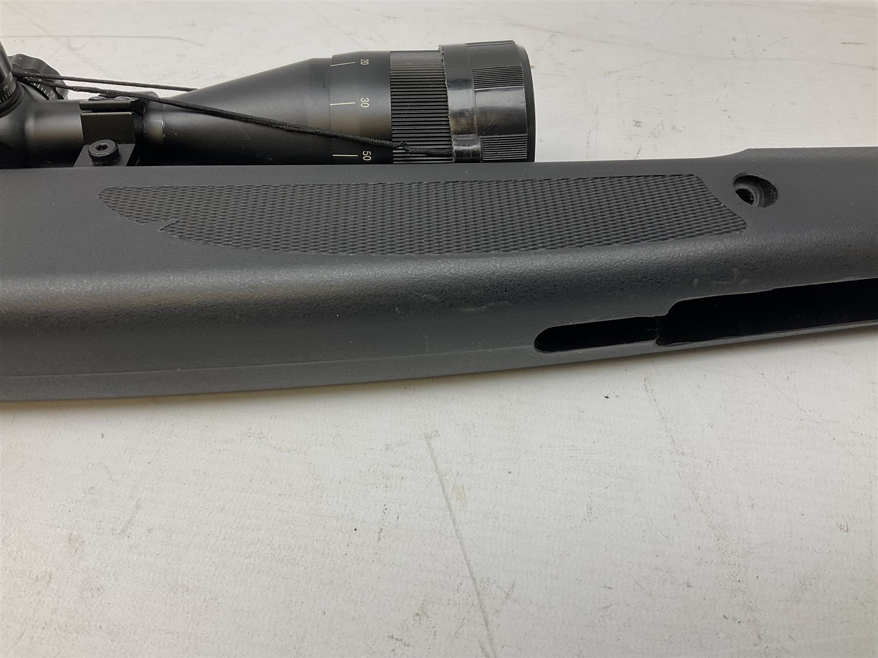 Stoegar .177 air rifle with break barrel action, 3 x 9 telescopic sight and fully integrated sound moderated barrel, no visible serial number, L109cm; in Stoeger lined gun sling